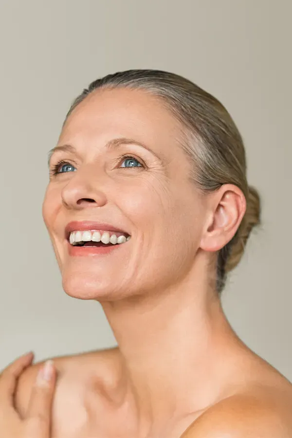 Biotin-IV-Therapy-Treatment A middle-aged woman with smooth, beautiful skin. Get Biotin IV therapy from Christine Collins, MD in Westside/Beverly Hills.