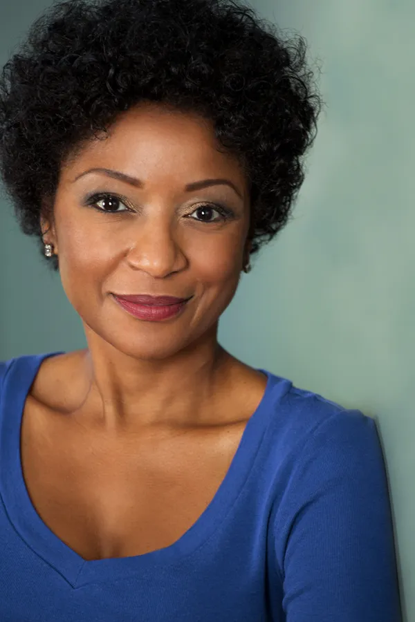 Femiwave-Treatment A middle-aged black woman in a blue shirt smiling. Get FemiWave treatment from Christine Collins, MD in Westside/Beverly Hills.