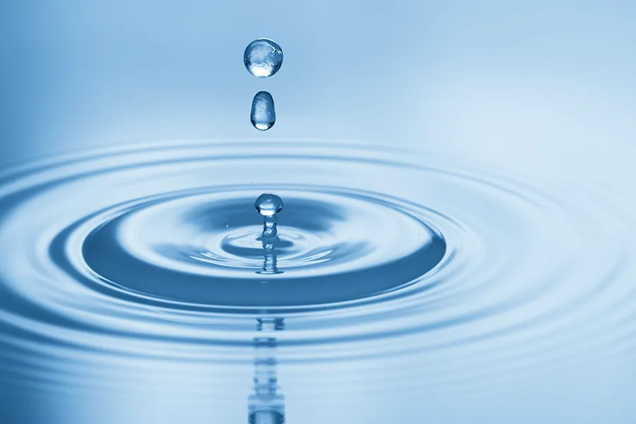 Hydration-IV-Therapy-Clinic Drops of water rippling in a smooth pool. Get Hydration IV Therapy from Christine Collins, MD in Westside/Beverly Hills.