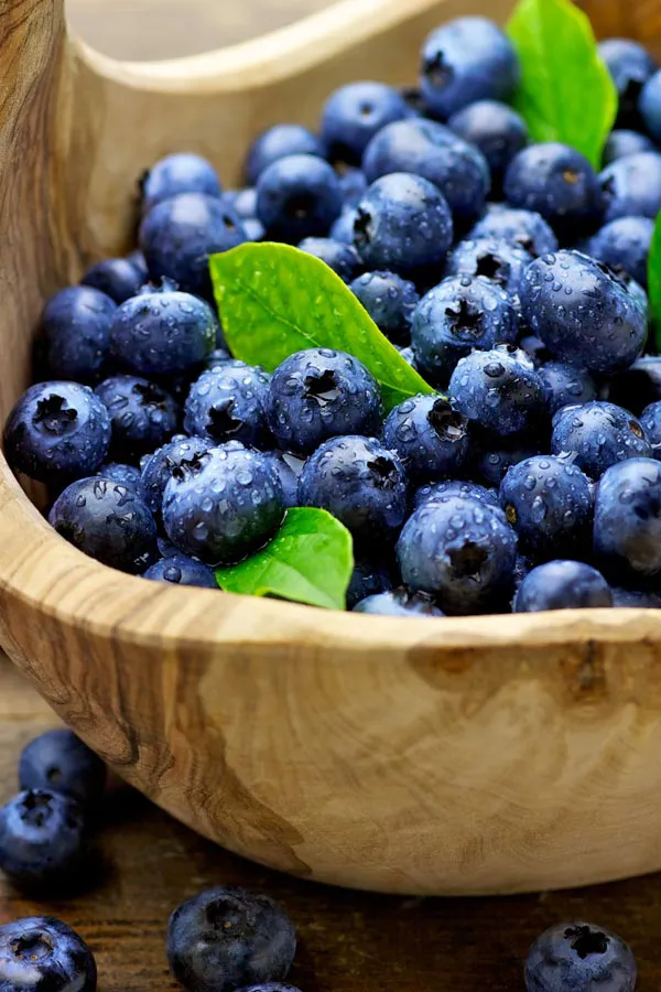 IV-Therapy-Treatment A bowl of refreshing, nourishing blueberries in a wooden bowl, representing IV therapy from Christine Collins, MD in Westside/Beverly Hills.