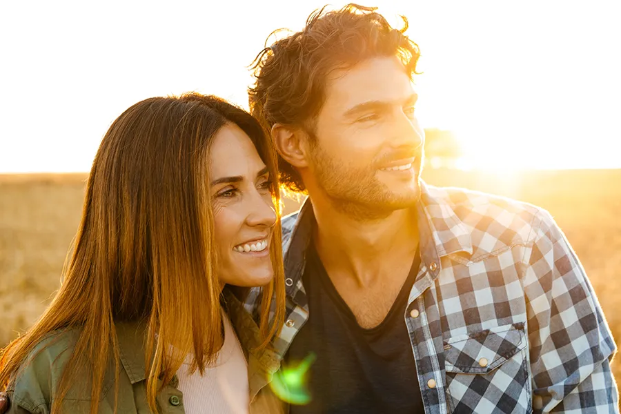 MIC-Vitamin-Injection-Clinic A middle-aged couple stand in a field at sunset. Schedule MIC Vitamin Injection treatment from Christine Collins, MD in Westside/Beverly Hills.
