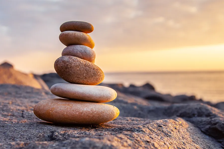 Mineral-Vitamin-Injection-Clinic-2 A stack of stones on the beach. Schedule Mineral Vitamin Injection treatment from Christine Collins, MD in Westside/Beverly Hills.