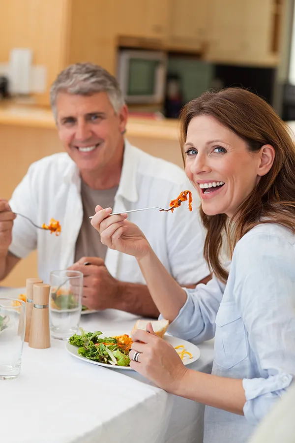 Vitamin-B6-Injection-Treatment A middle-aged couple shares a healthy dinner. Get Vitamin B6 Injection treatment from Christine Collins, MD in Westside/Beverly Hills.